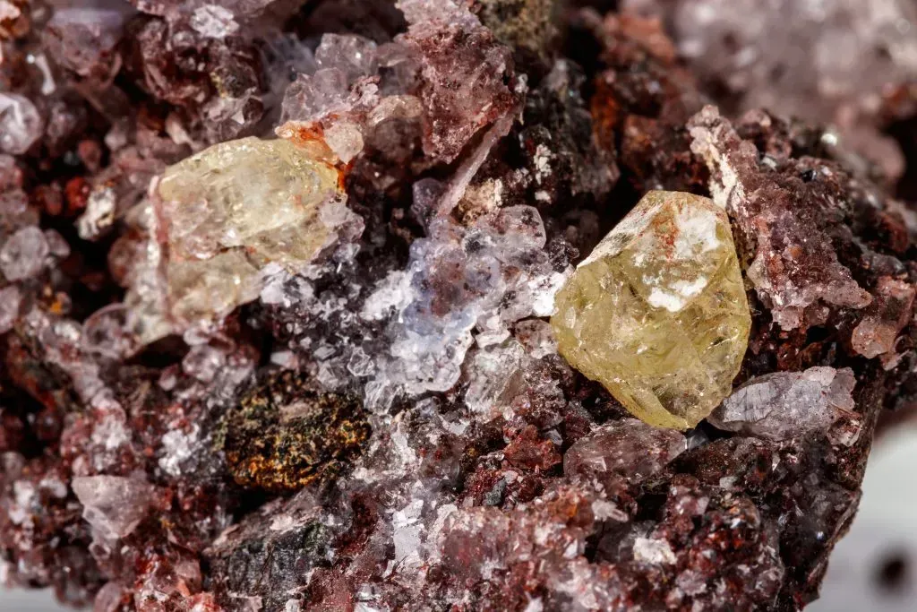Rough yellow apatite crystal in host rock.